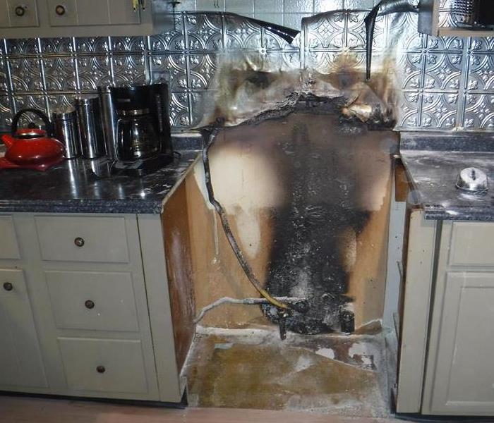 a stove that has been completely destroyed by fire