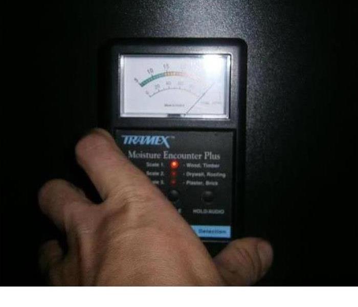 A moisture measuring device in use